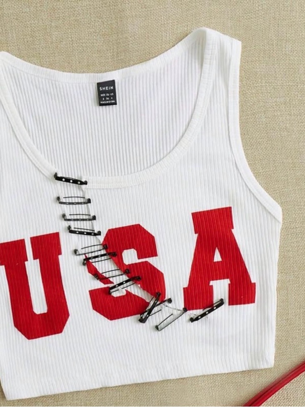 White Ribbed Crop Tank with Red USA Lettering and Safety Pin Accent